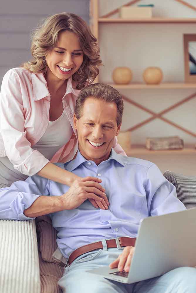 Couple going over their Medicare options on a laptop